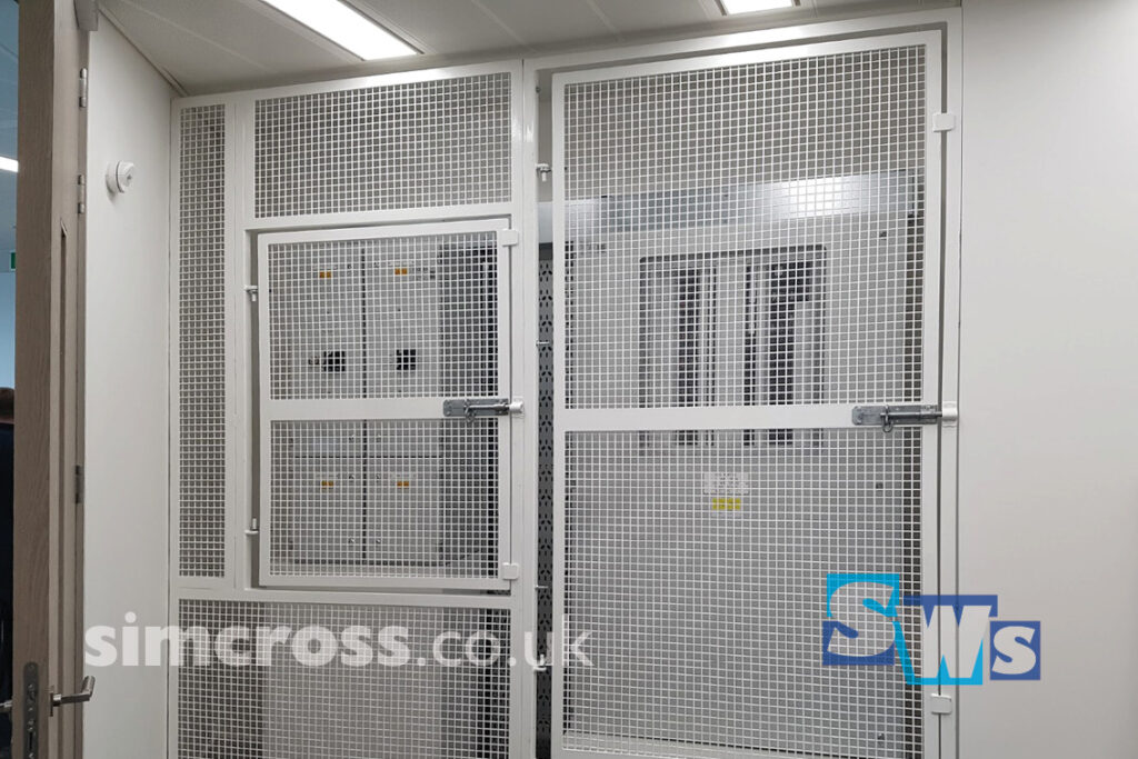 Bespoke steel grid doors securing electric panels fabricated by Simcross Welding Services, London and Herts