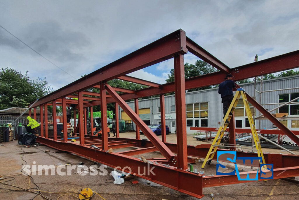 Epsom Hospital – walkway structure assembled in Simcross workshop and fitted on site in one piece. Simcross Welding Services – structural steel, London and Herts